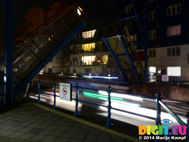 FZ010550 Lights of boat going through bridge into Exmouth harbour at night